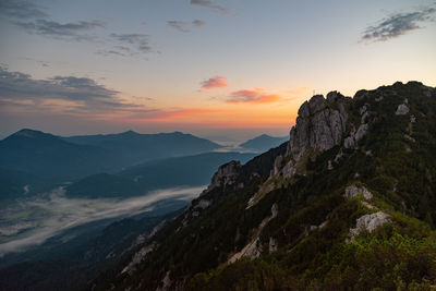 Scenic view of mountains against sky during sunset