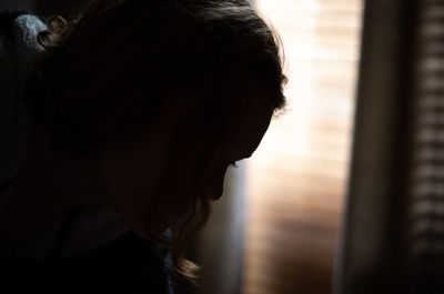 Close-up portrait of a woman at home