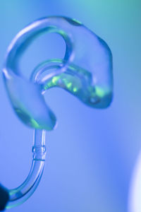 Close-up of water drop against blue background