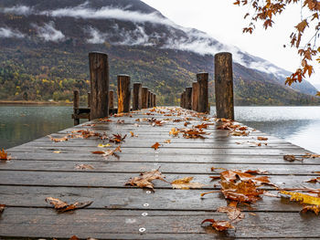 Wood pier on lake piano in autumn