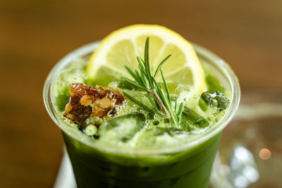 Close-up shot of delicious honey lemon green tea drink