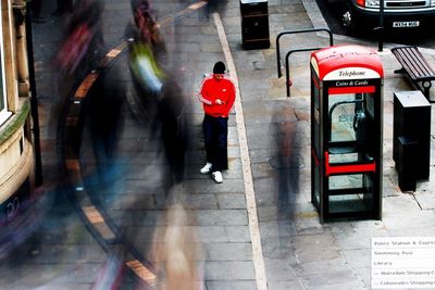 Blurred motion of people on road