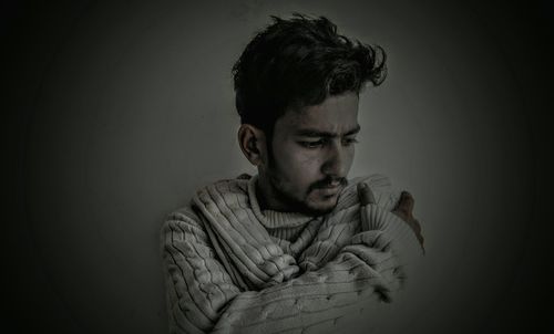 Sad man against gray background