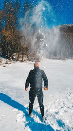 Rear view of man on snow field