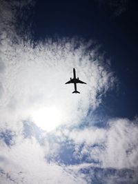 Low angle view of airplane in sky