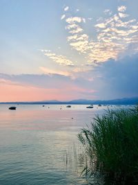 Scenic view of sea against sky at sunset