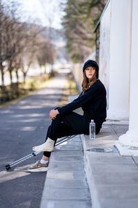 Portrait of young woman walking on street