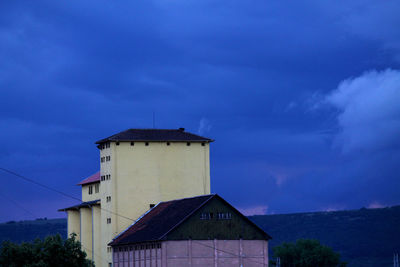 Low angle view of building against blue sky