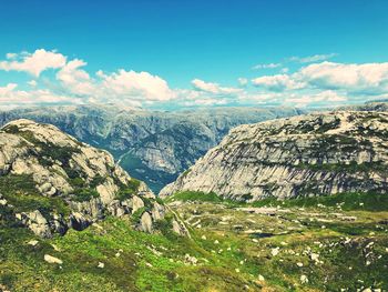 Scenic view of landscape and mountains against sky