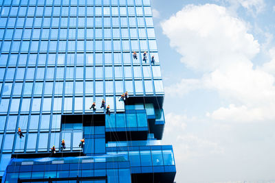 Low angle view of office building against sky