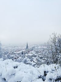 Scenic view of snow covered trees against sky