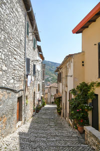 Old houses on a narrow street in maenza, a medieval village near rome in italy.