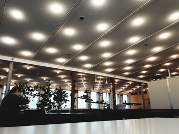 Low angle view of illuminated lights in ceiling