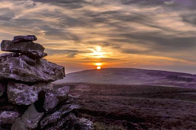 Scenic view of landscape against sky during sunset