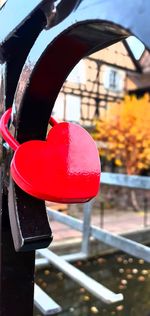 Close-up of heart shape hanging on metal