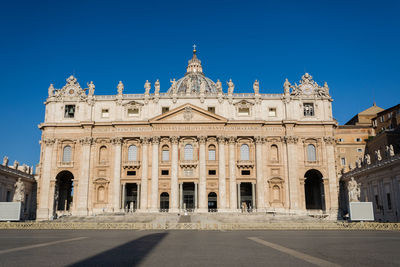 Facade of historic building against clear blue sky