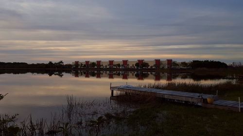 Reflection of clouds in lake at sunset