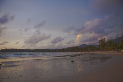 Scenic view of beach against sky during sunset