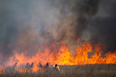 View of bonfire on field