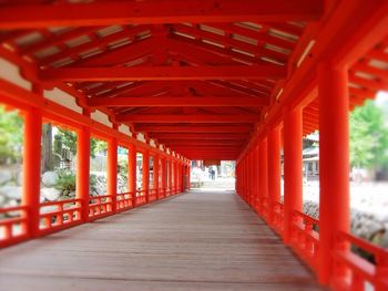 Empty road with columns in background