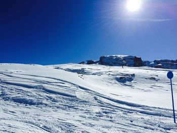 Scenic view of snow covered mountain against sky