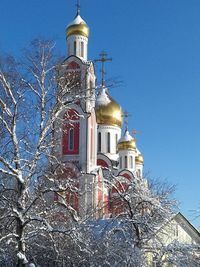 Low angle view of bell tower against clear sky