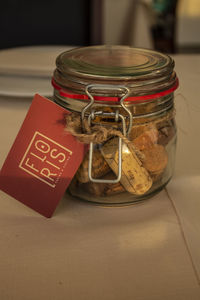 High angle view of small glass in jar on table