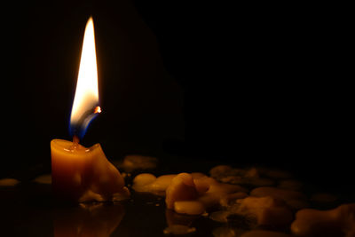 Close-up of illuminated candle