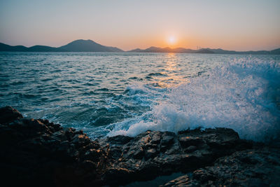 Scenic view of sea against sky during sunset