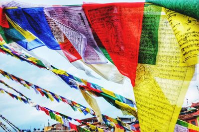 High angle view of multi colored flags hanging at market stall