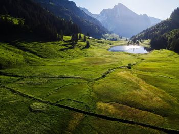 Scenic view of landscape and mountain lake