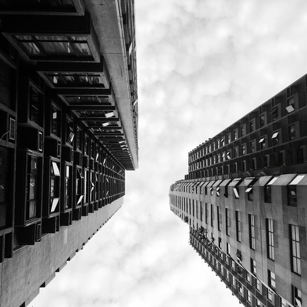 architecture, built structure, sky, building exterior, low angle view, day, cloud - sky, outdoors, no people, city, modern