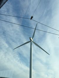 Low angle view of telephone pole against sky