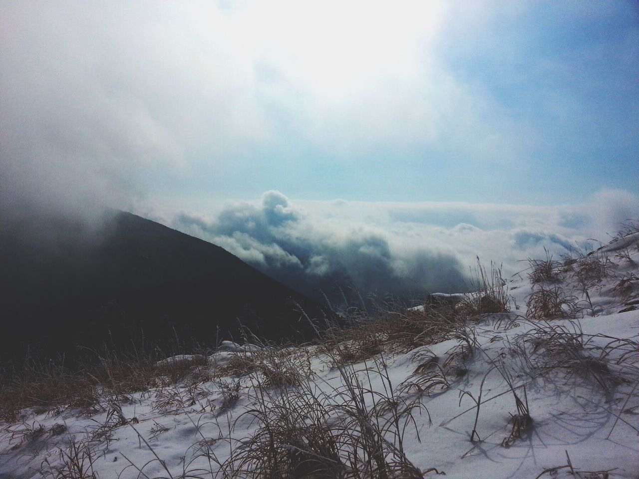 sky, scenics, tranquil scene, tranquility, water, beauty in nature, weather, cloud - sky, mountain, nature, winter, fog, cold temperature, lake, cloudy, landscape, idyllic, snow, day, mountain range