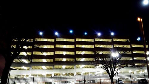 Low angle view of illuminated street light at night