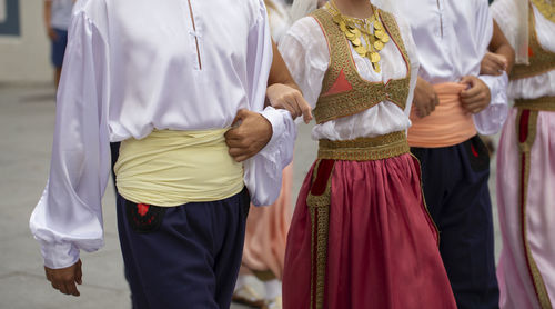 Midsection of people standing in temple