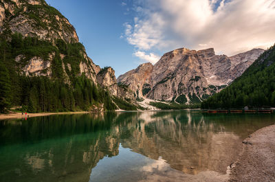 Scenic view of lake and mountains against sky