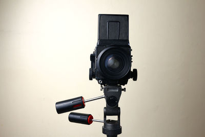 Close-up of camera against white background