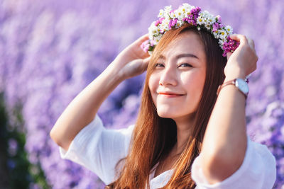 Portrait of young woman looking at camera