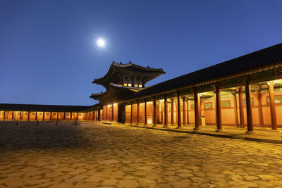 View of illuminated building against sky at night