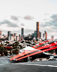 City street and buildings against sky