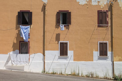 Clothes drying on window during sunny day