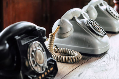 Close-up of vintage telephones on table