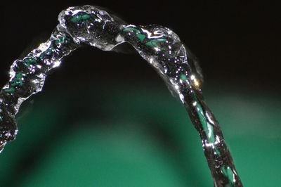 Close-up of water drop against black background