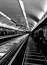 High angle view of people on escalator at subway station