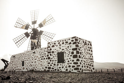 Low angle view of windmill against clear sky