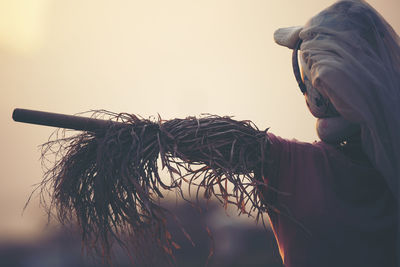Close-up of scarecrow during sunset
