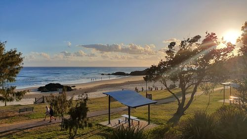 Scenic view of beach against sky during sunset