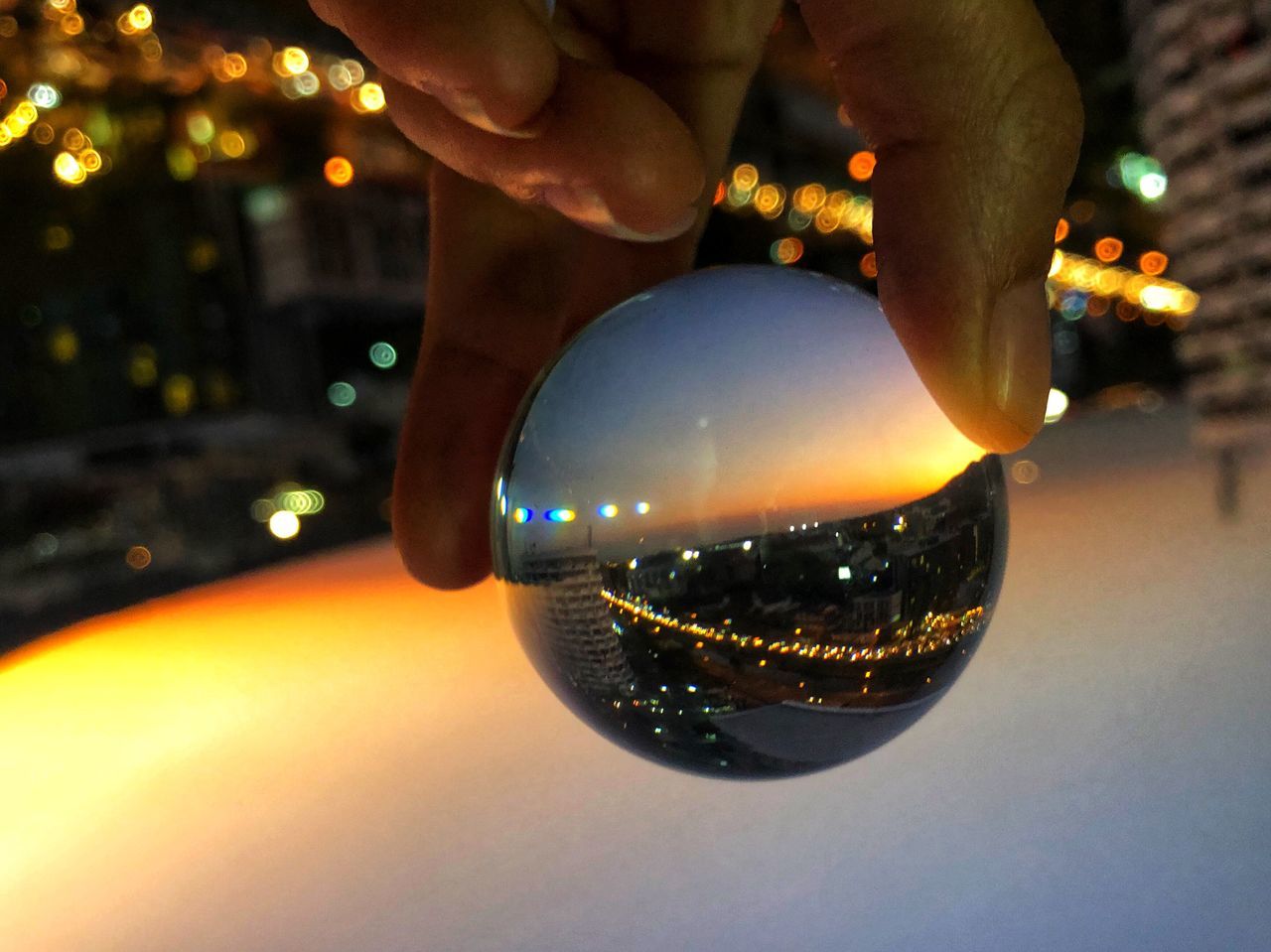 CLOSE-UP OF HAND HOLDING BALL