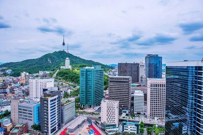 High angle view of buildings against sky in city